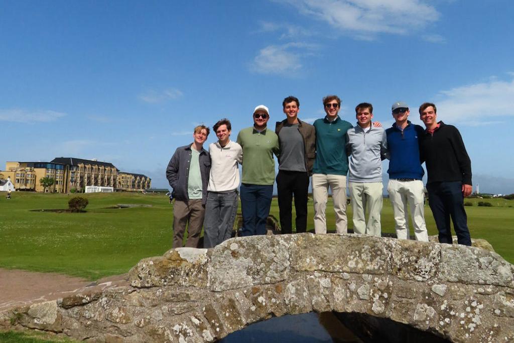 Students pose on Swilcan Bridge at St Andrews Links.