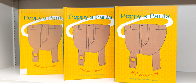 three copies of children's book Poppy Pants sitting on a shelf