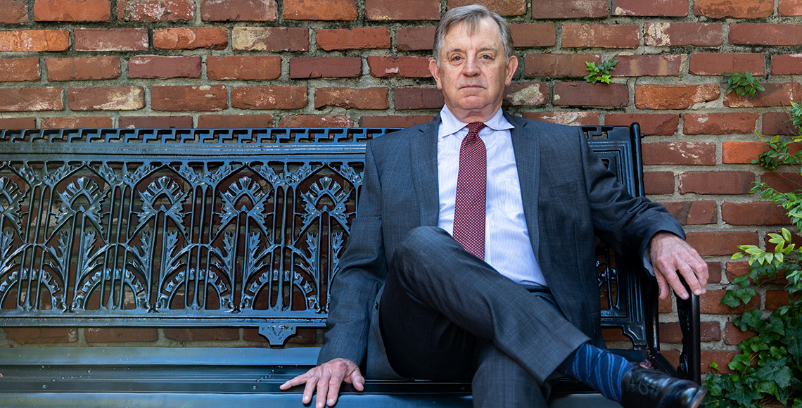 Parks Rogers sitting on a bench on the Horseshoe