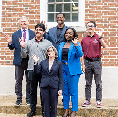 administrators waving to the camera