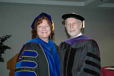 Sam Hastings and Charles Bierbauer at hooding ceremony