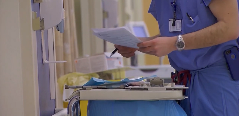a doctor holding a chart
