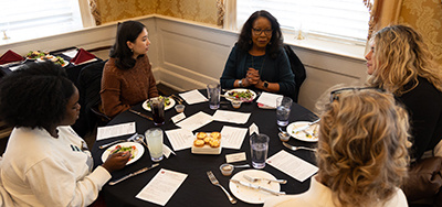 Shirley Staples Carter at a table with students