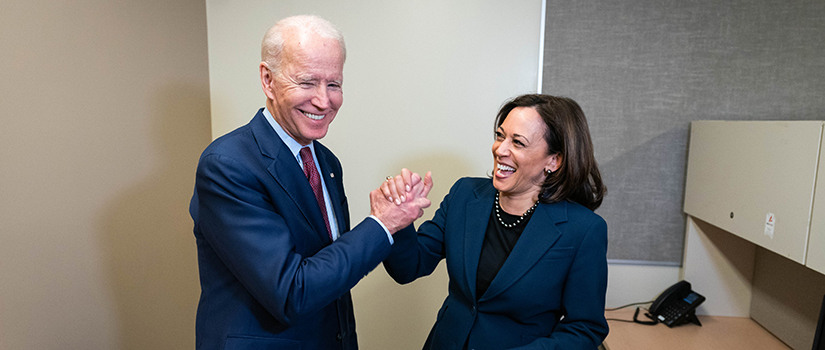 Joe Biden and Kamala Harris giving each other a high-five.
