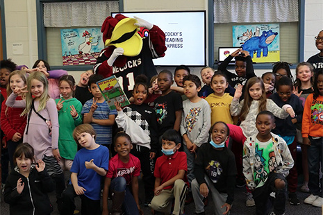 Cocky poses with school children from A.C. Moore elementary.