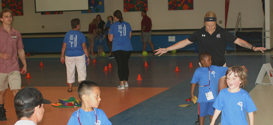 PE students work with young children at the center