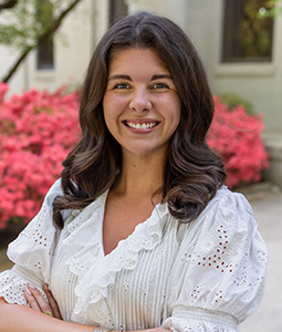 Bailey Berquist, arms folded, smiling