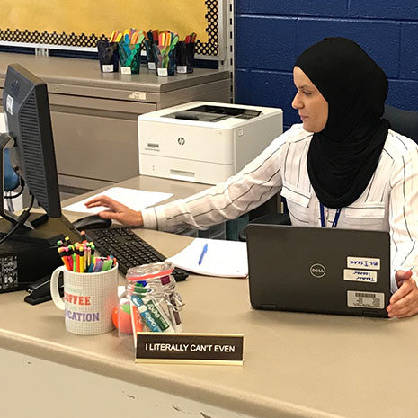 Iman Askar at her desk