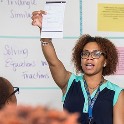 teacher holding up paper