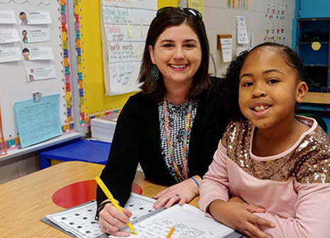 Michelle Taylor and student in classroom