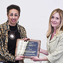 Millicent E. Brown receiving the Travelstead Award