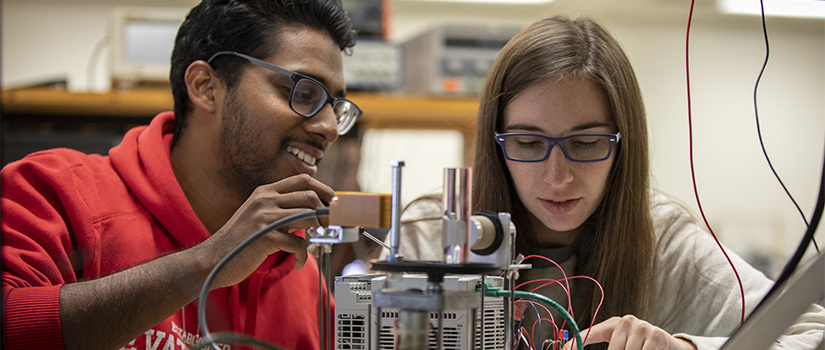 two students in an electrical engineering lab