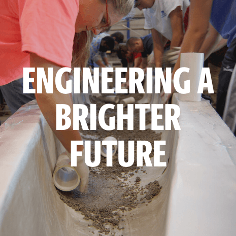 hands hollow out a concrete canoe text says engineering a brighter future