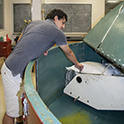a grad student works with the centrifuge