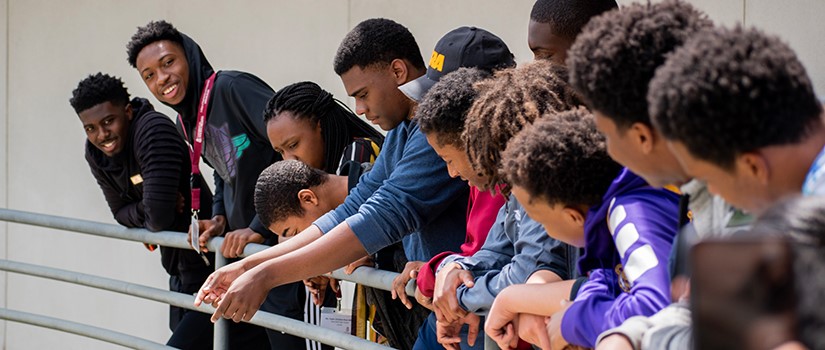 students looking at drone