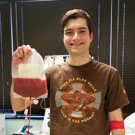 Josh Mulliken holding blood donation
