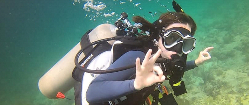 Olga goes scuba diving.