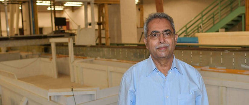 Chaudhry standing in lab