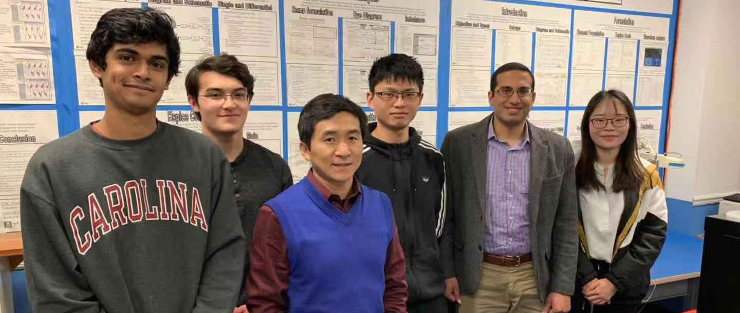 Professor Guoan Wang with student interns.