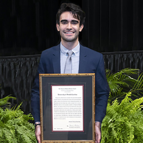 image of Gabe Carrilho and his award