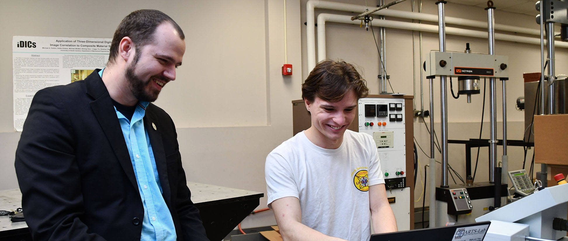 Mechanical Engineering Associate Professor Austin Downey and student