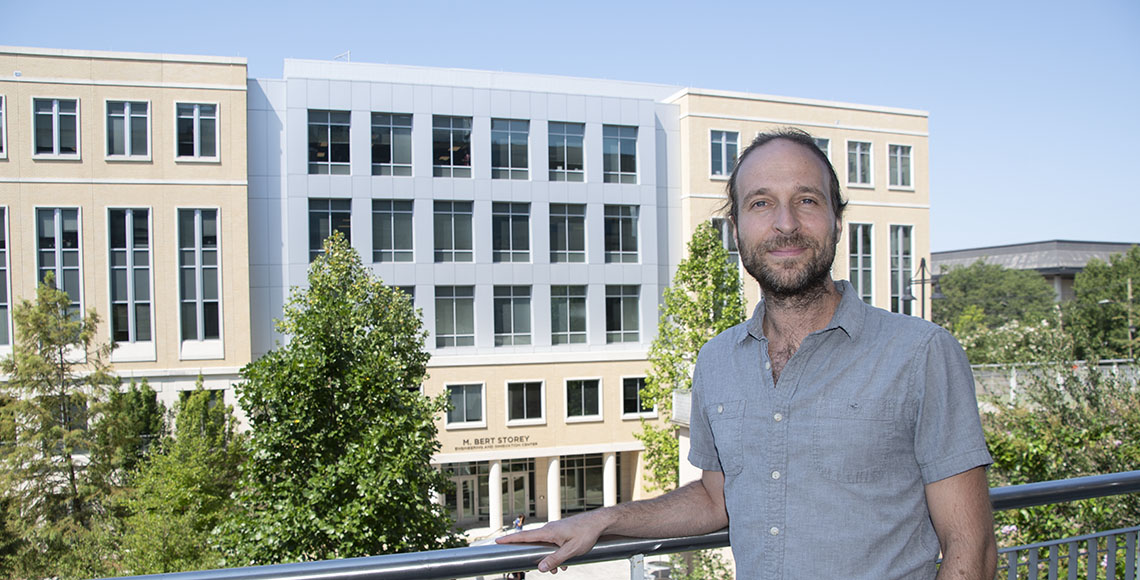 Christian O'Reilly standing in front of the Storey Innovation Center building