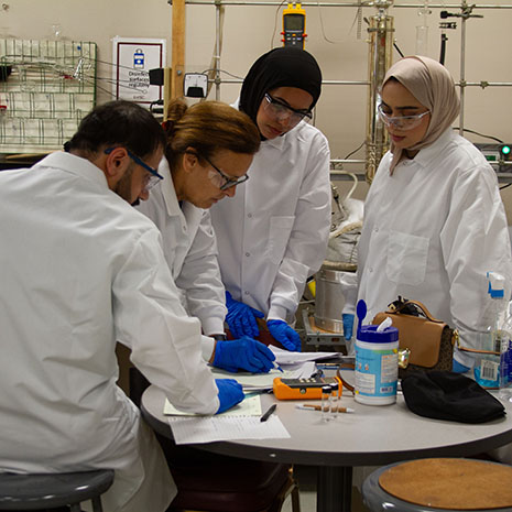 NUST Oman students in a chemical engineering lab in the summer of 2025