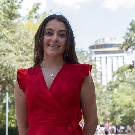 Jessica Schmidt in front of Capstone building