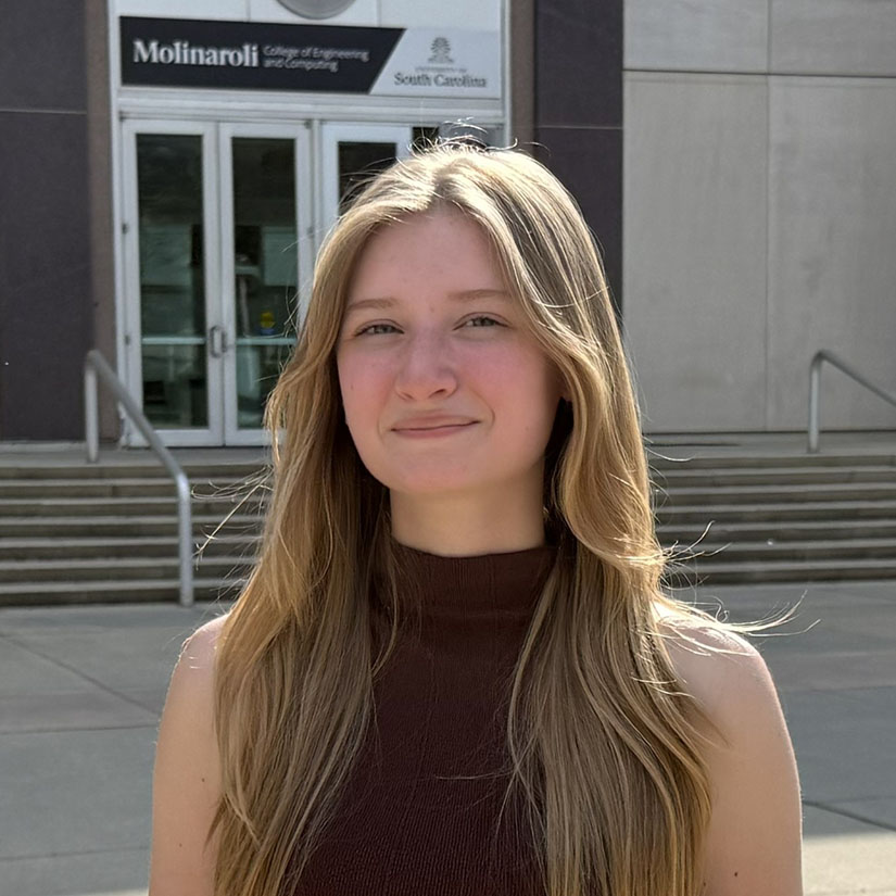 Eva Wilson standing in front of the Main Street entrance to Swearingen.