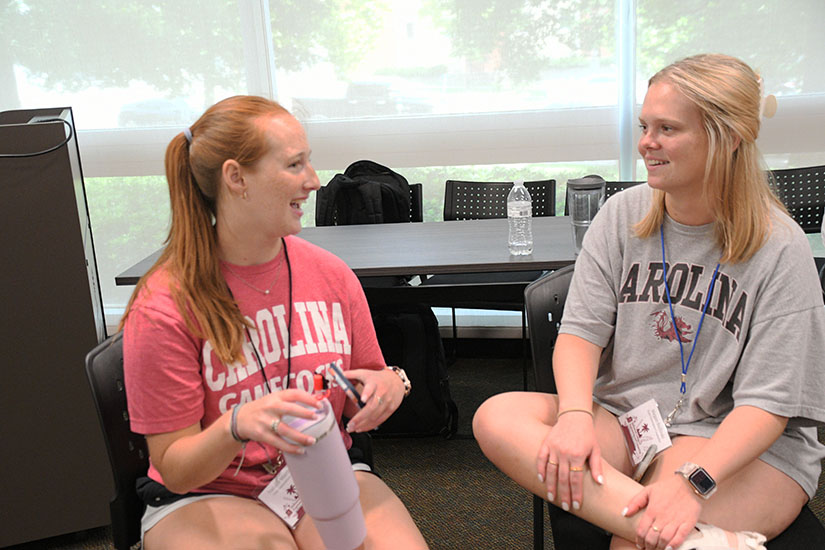 Student and counselor talking during the Summer Start Program. 