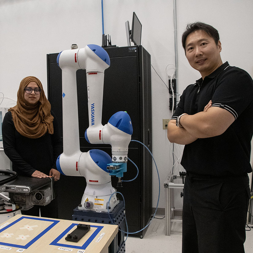 Nishat Alam (left) and JuHyeong Ryu (right) inside of the McNair Center's Future Factories lab. 