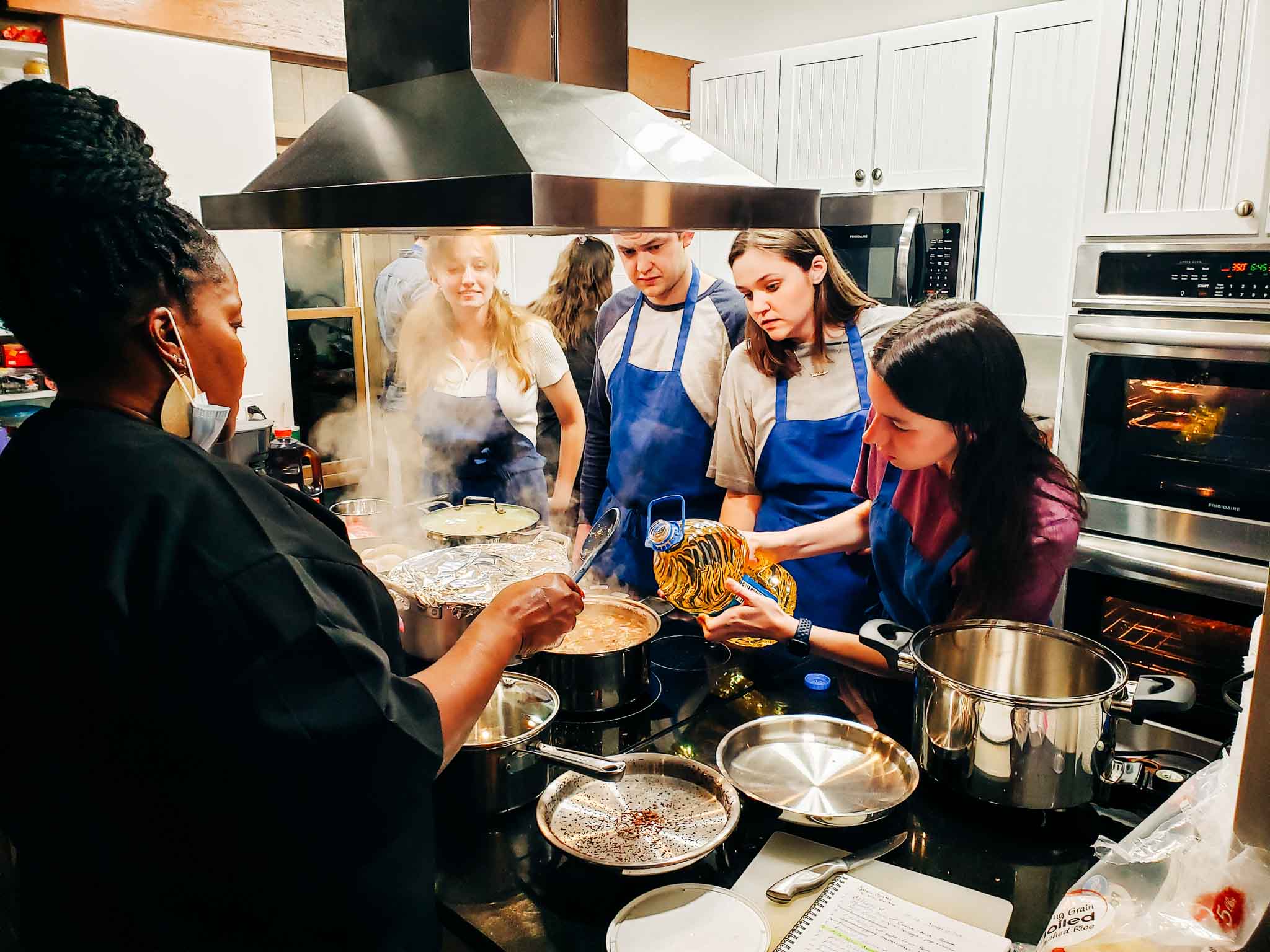 Students working with local guest chefs to create authentic lowcountry cuisine. 