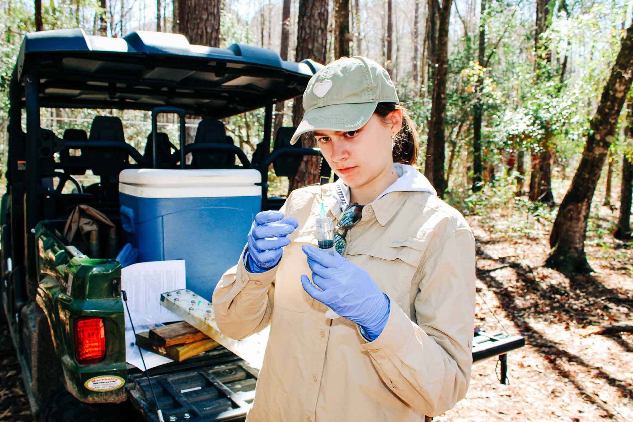 A member of the cohort taking samples while out in the field. 