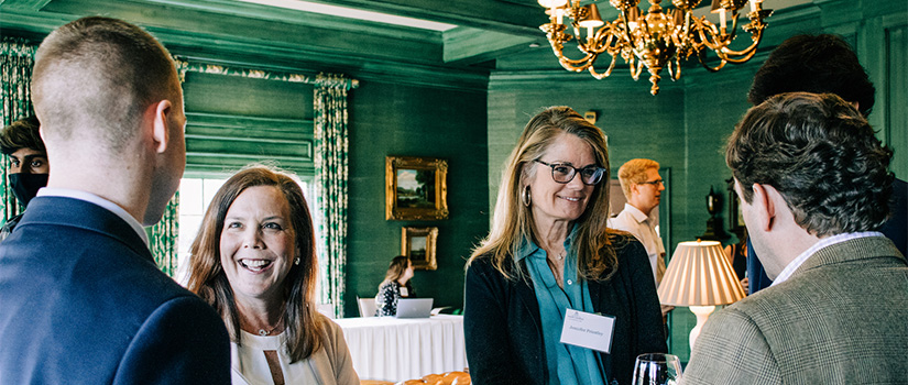 Honors Alumni together in fellowship at an event.