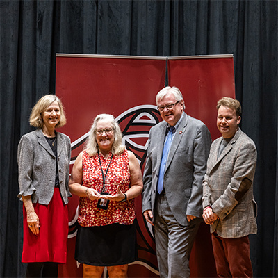 Jan Smoak holding her award.