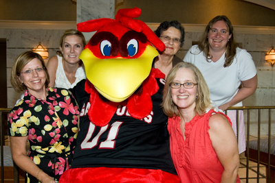 Smoak and Scholar Programs staff posing with Cocky.