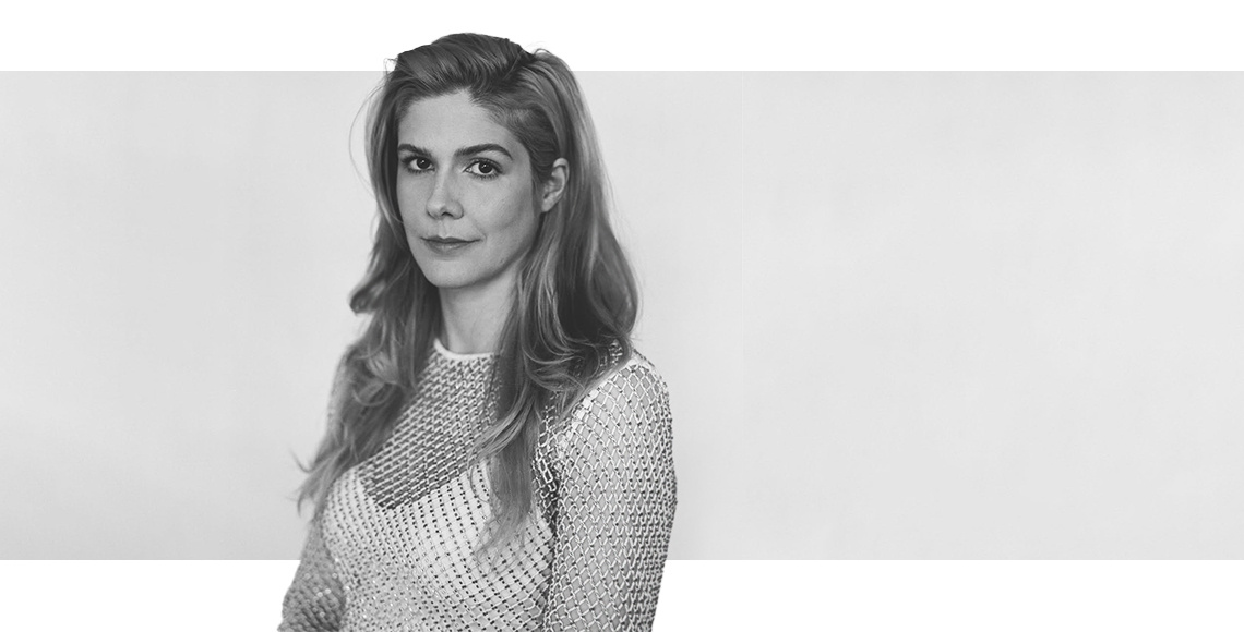 Woman with a gray background behind her