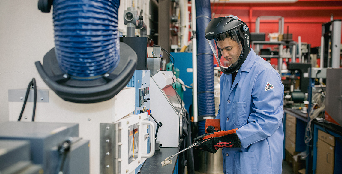 Christopher Carter working in a lab at Massachusetts Institute of Technology.