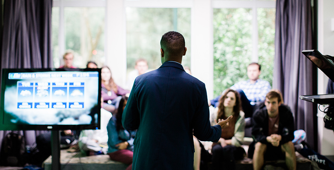 Professor standing in front of students