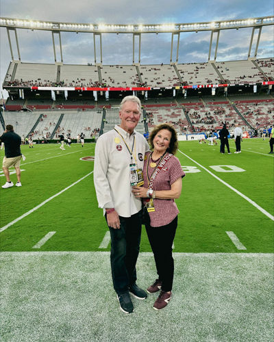 Jamie Hammill and Lanny Secrest at a football game