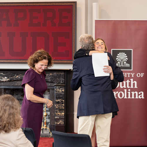 Courtney Tkacs hugging Lanny Secrest