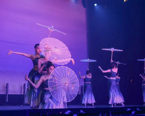 Amber Tu performing on stage.