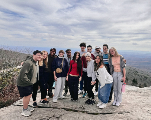 Hannah Keen with friends on a mountain.