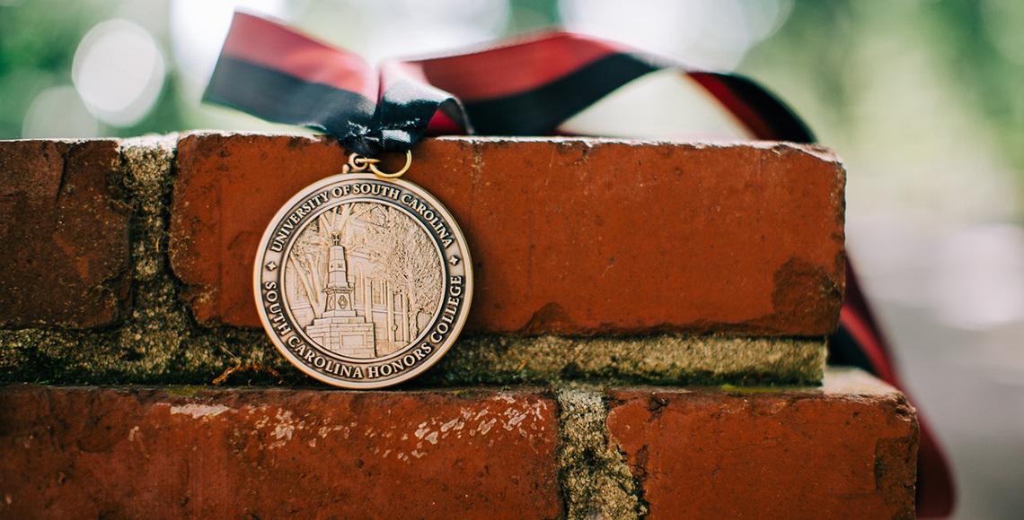 Honors College medallion on bricks