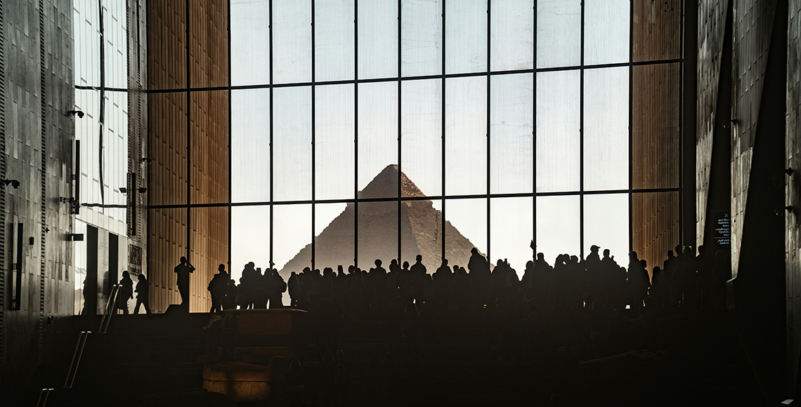 Group of people admiring the Great Pyramids in Egypt
