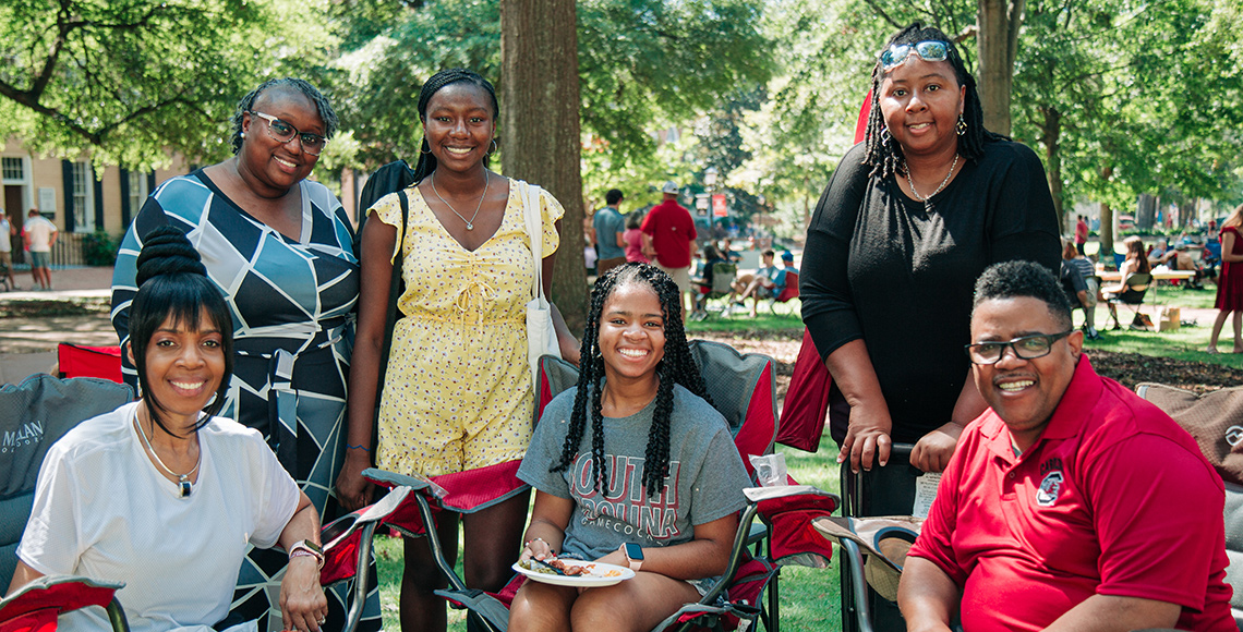 A family posing for a photo on the Horseshoe