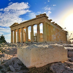 Greek parthenon against a blue sky