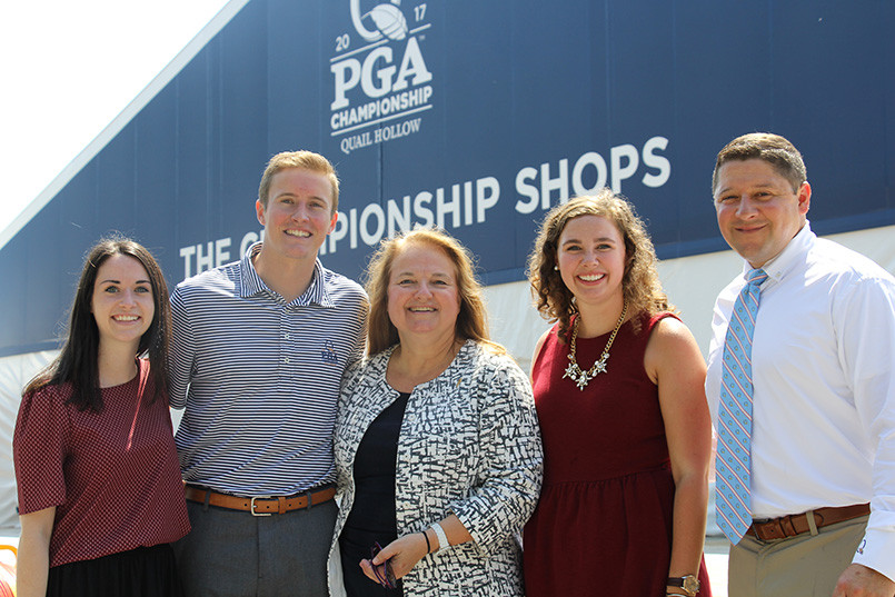 (L-R): College of HRSM alumni Rachel Nesbitt and Kyler Rose, HRTM associate professor Cathy Gustafson, alumna Mary Elizabeth Dew and Quail Hollow Club GM and alumnus Tom DeLozier pose for a photo while preparing to work the 2017 PGA Championship.