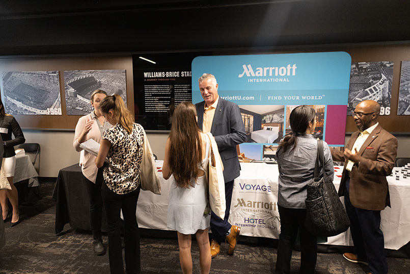 Marriott International representatives speak with students at the Experience Expo job fair event.