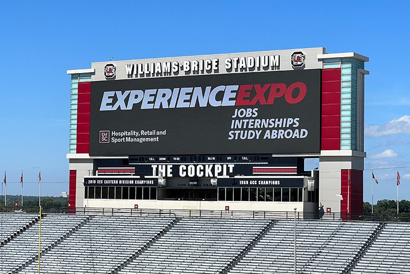 The large video board at Williams-Brice Stadium displays signage for the Experience Expo job fair held there in fall 2022.
